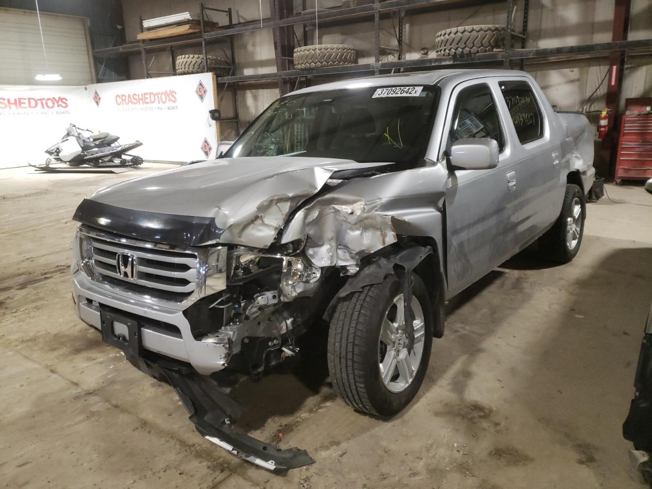 Photo 2 from auction – 2014 HONDA RIDGELINE with VIN 5FPYK1F58EB013567