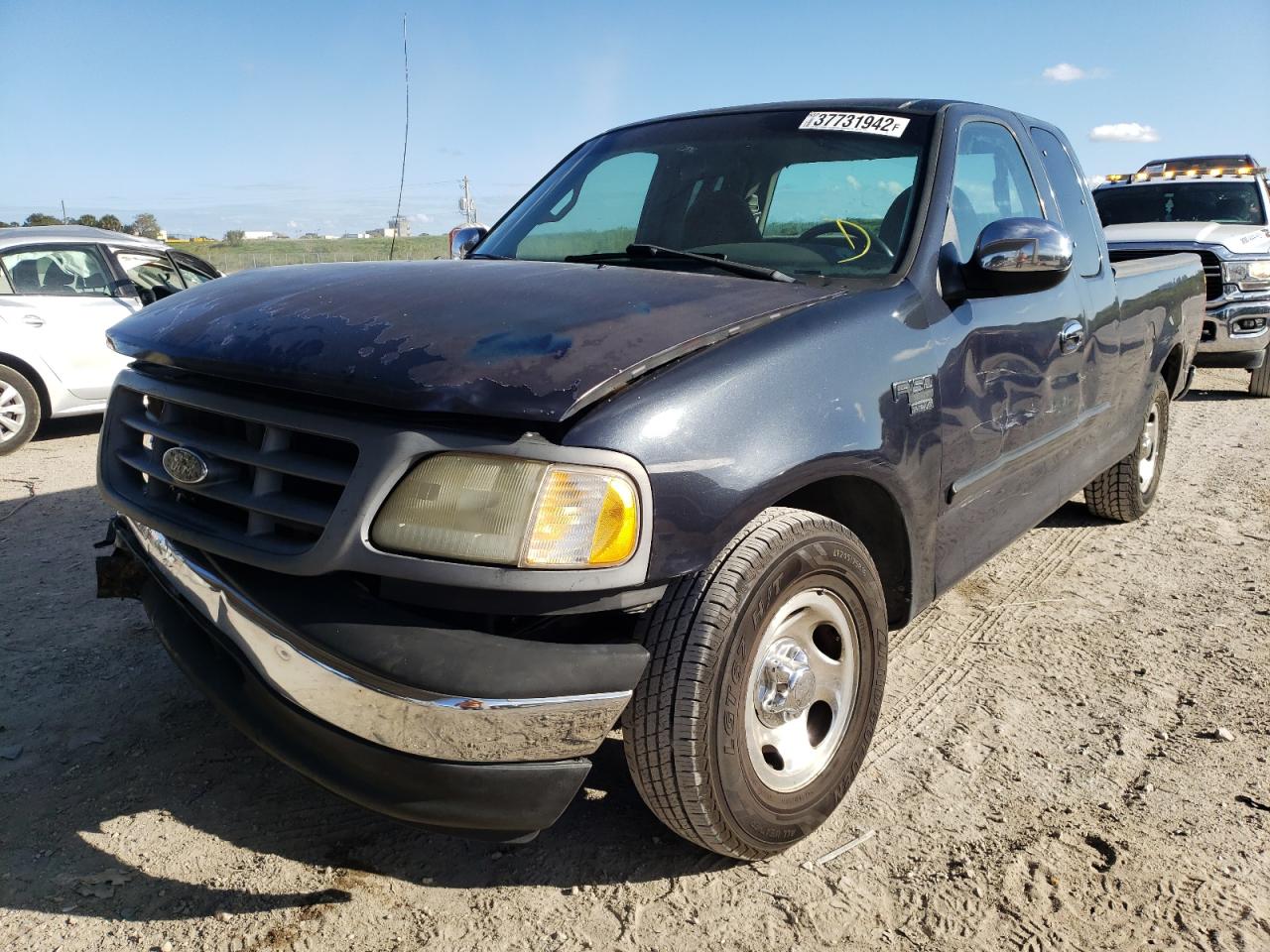 Photo 2 from auction – 1999 FORD F150 with VIN 1FTRX17W8XNC02830