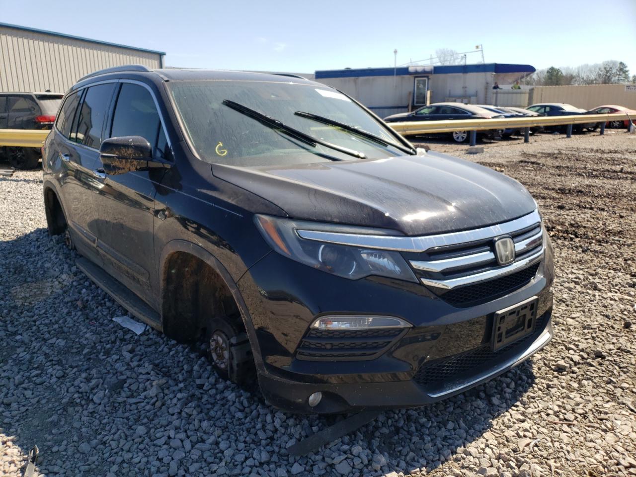 HONDA PILOT TOUR 2016 with VIN 5FNYF5H94GB004744 - Photo from auction