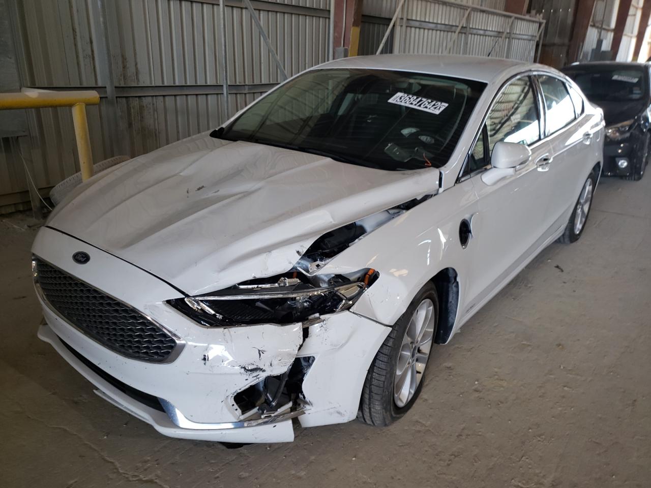 Photo 2 from auction – 2020 FORD FUSION TIT with VIN 3FA6P0SU1LR133365