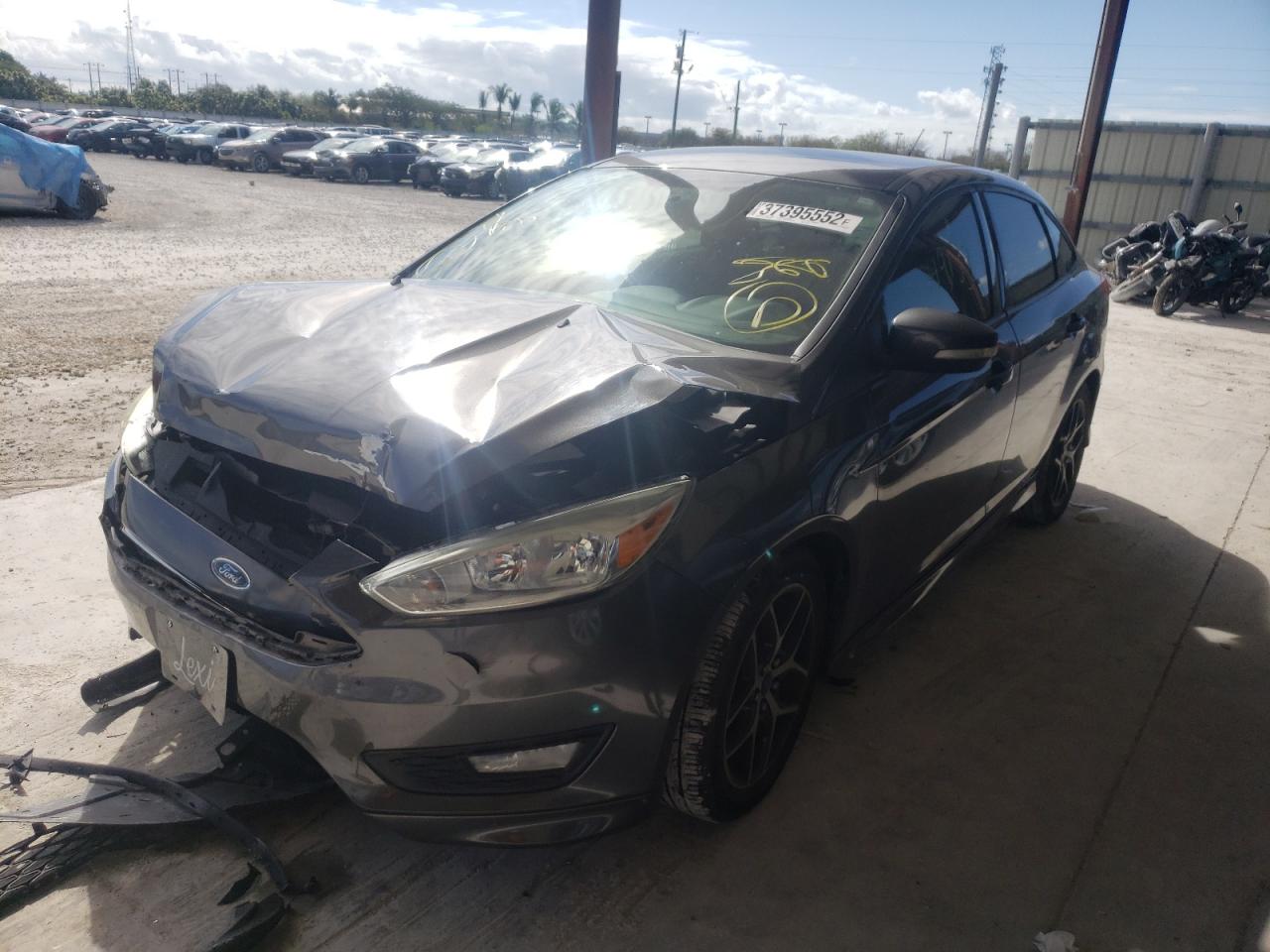 Photo 2 from auction – 2015 FORD FOCUS SE with VIN 1FADP3F24FL215594