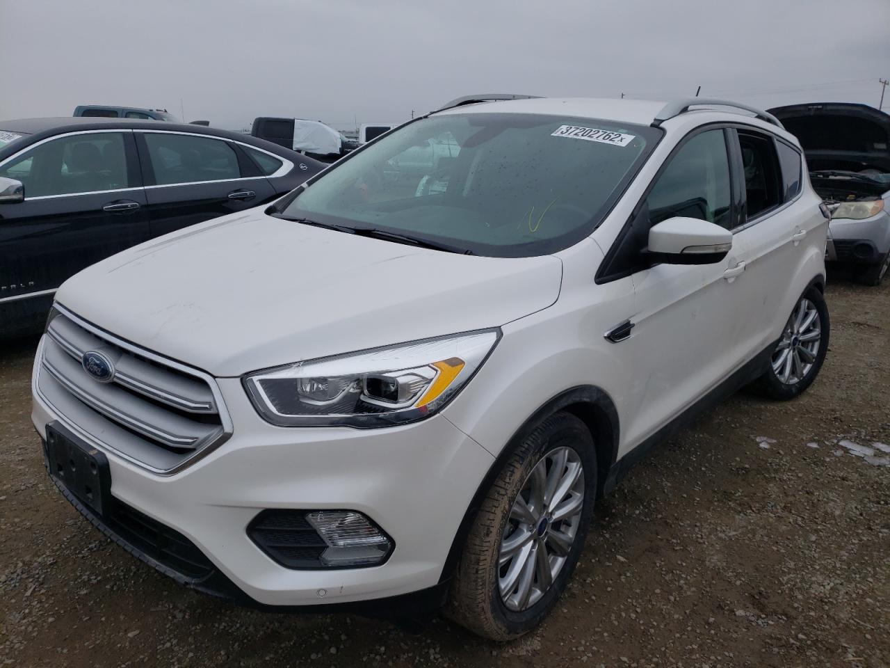 Photo 2 from auction – 2018 FORD ESCAPE TIT with VIN 1FMCU9J99JUB26690