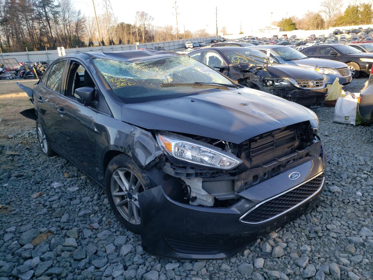 FORD FOCUS SE 2016 with VIN 1FADP3F2XGL210353 - Photo from auction
