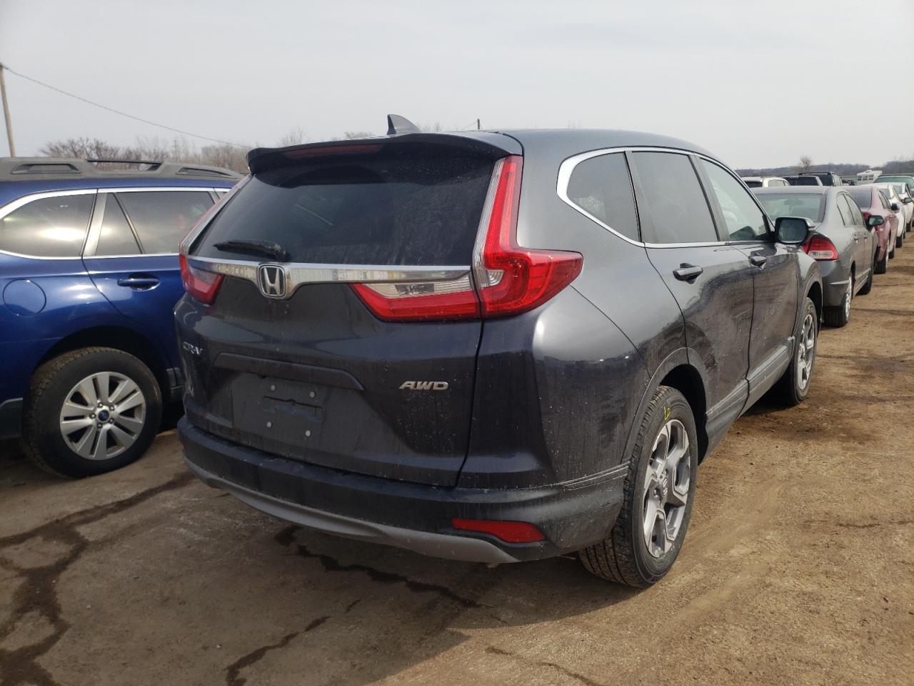 Photo 4 from auction – 2018 HONDA CR-V EXL with VIN 7FARW2H83JE054458