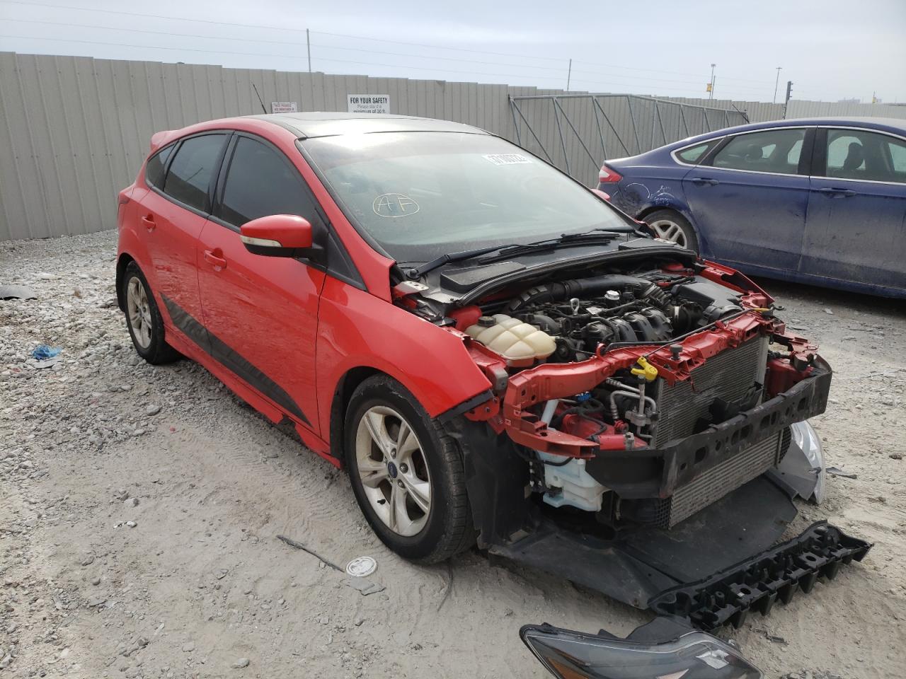FORD FOCUS ST 2014 with VIN 1FADP3L9XEL299064 - Photo from auction