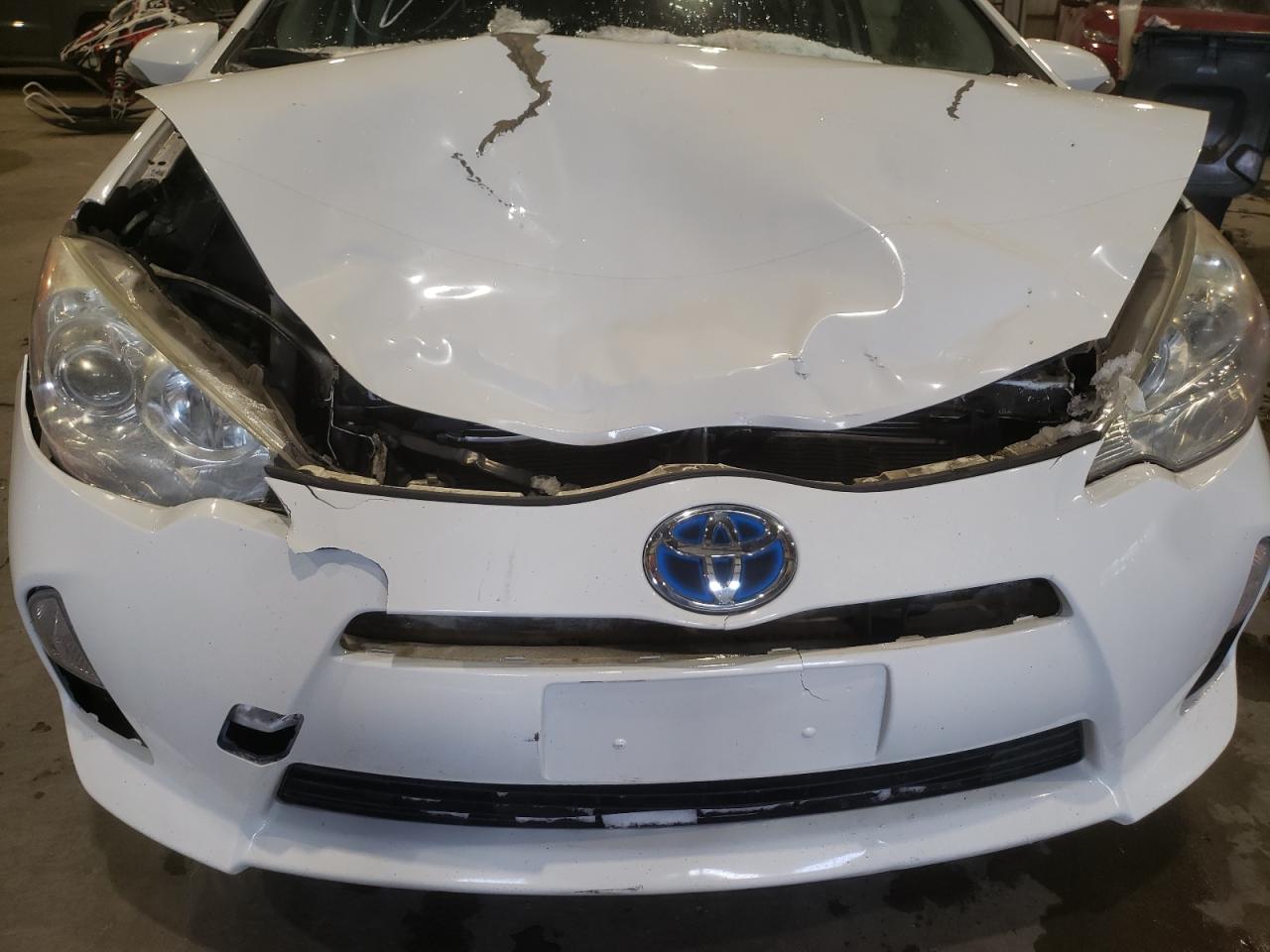 Photo 9 from auction – 2014 TOYOTA PRIUS C with VIN JTDKDTB37E1558712