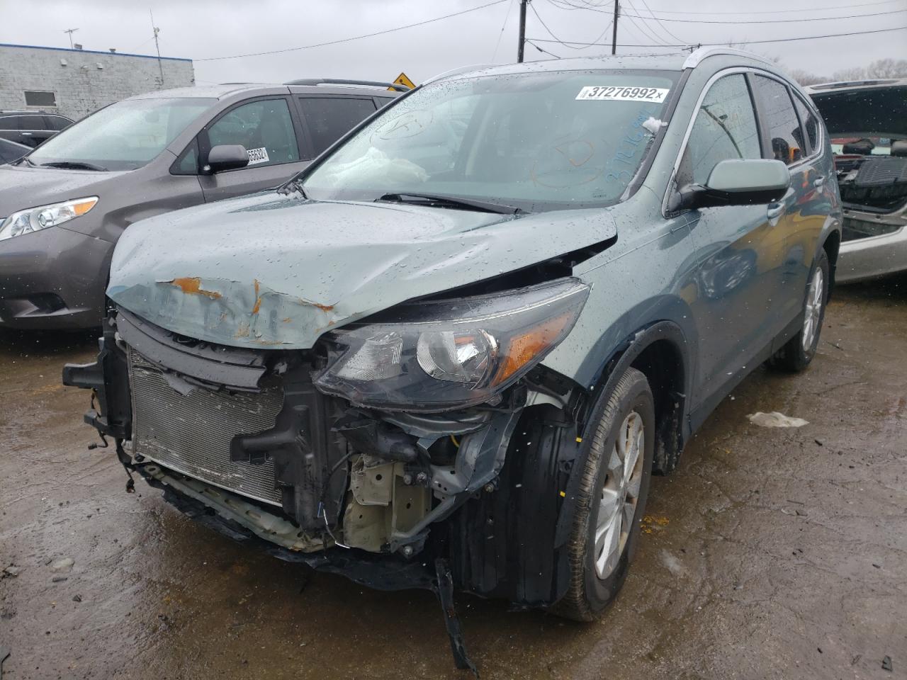 Photo 2 from auction – 2012 HONDA CR-V EXL with VIN 5J6RM4H79CL016473