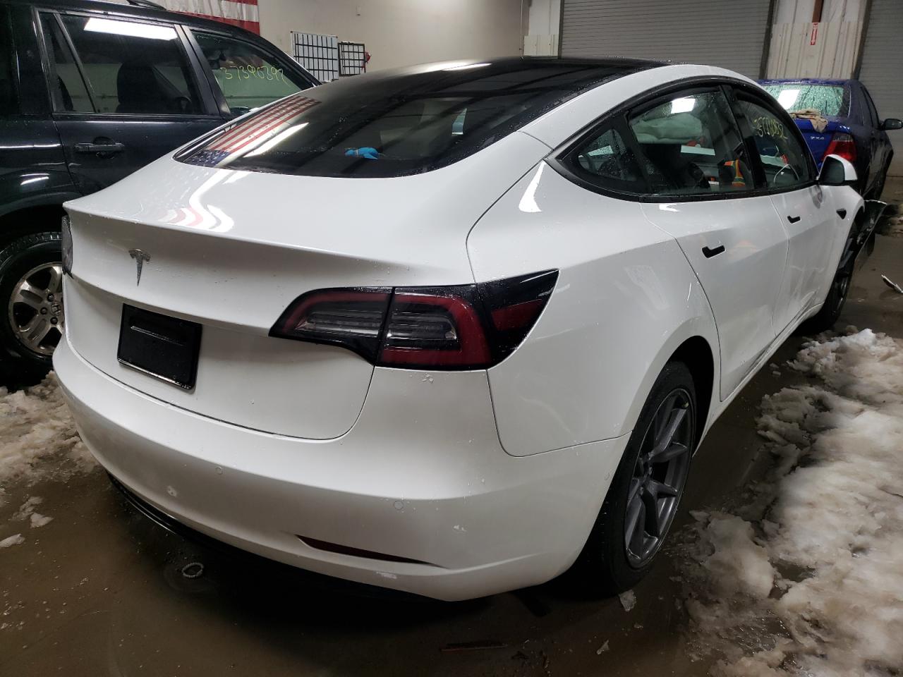 Photo 4 from auction – 2021 TESLA MODEL 3 with VIN 5YJ3E1EA5MF047666