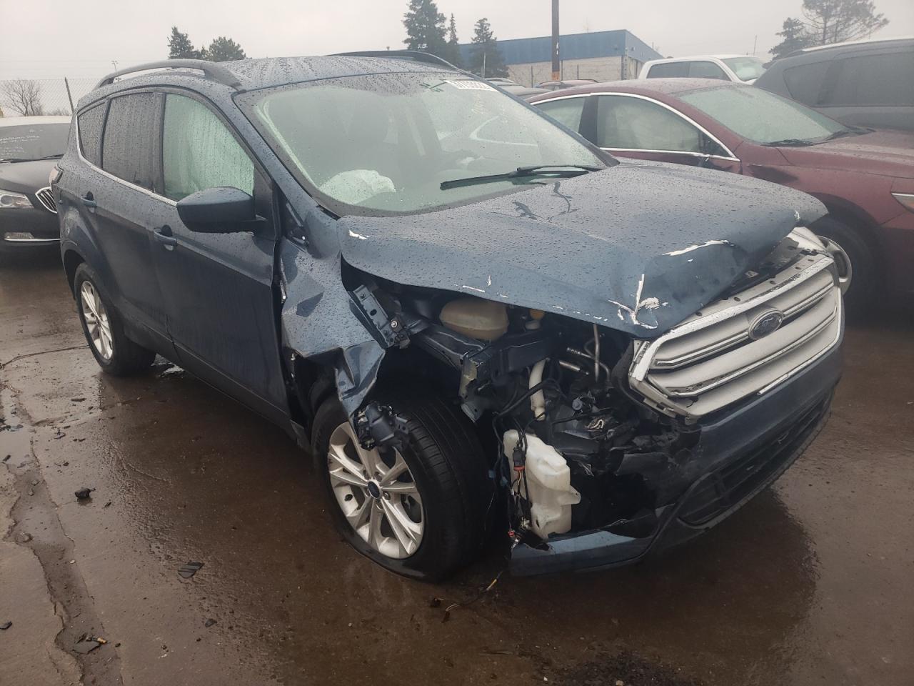 FORD ESCAPE SE 2018 with VIN 1FMCU9GD2JUB41334 - Photo from auction