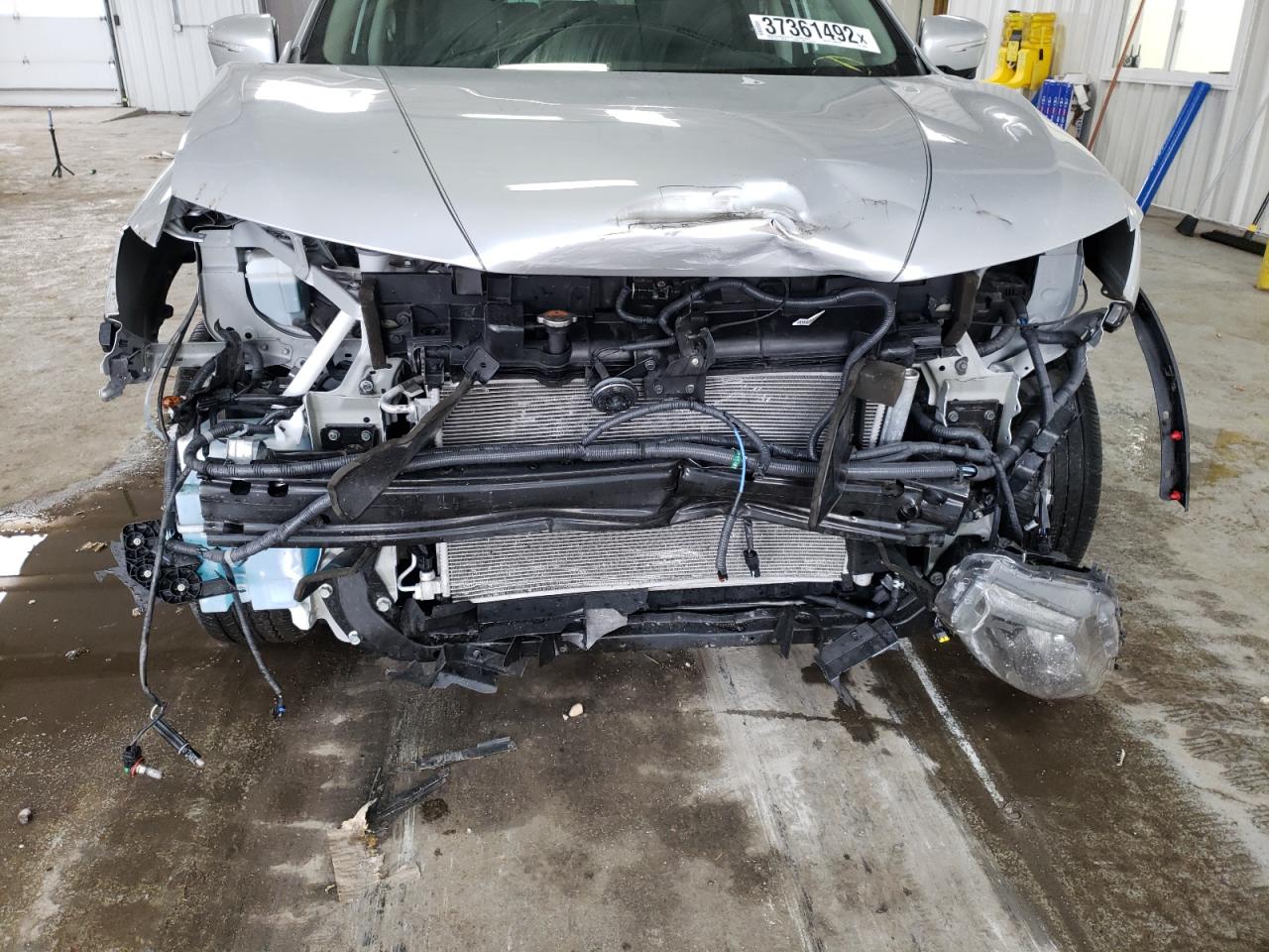 Photo 9 from auction – 2015 NISSAN ROGUE S with VIN 5N1AT2MV2FC790398