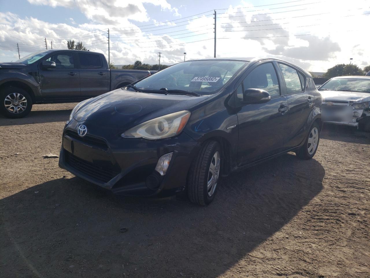 Photo 2 from auction – 2015 TOYOTA PRIUS C with VIN JTDKDTB36F1585420