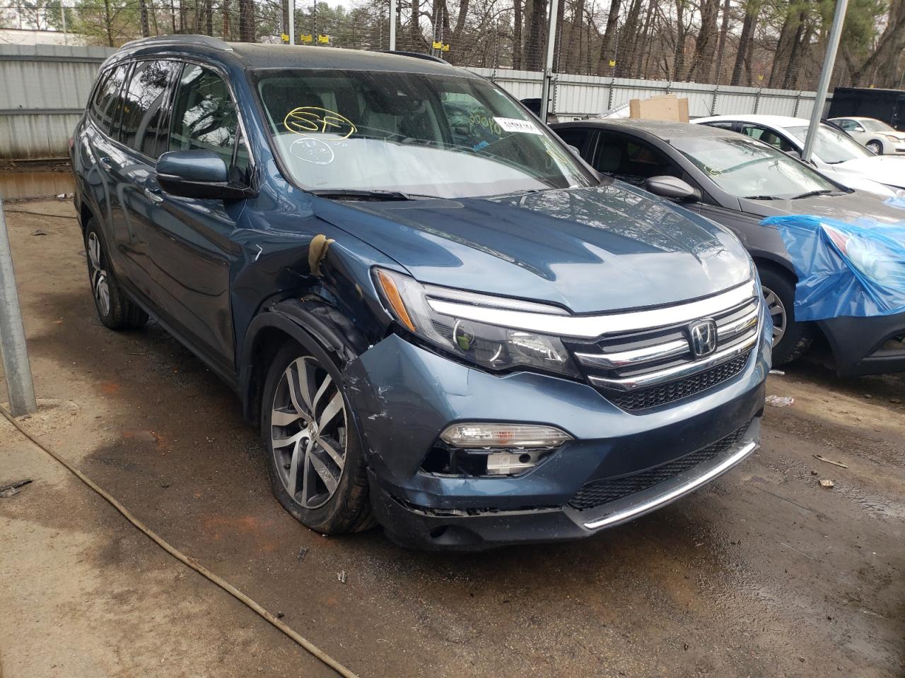 HONDA PILOT ELIT 2018 with VIN 5FNYF6H0XJB015133 - Photo from auction