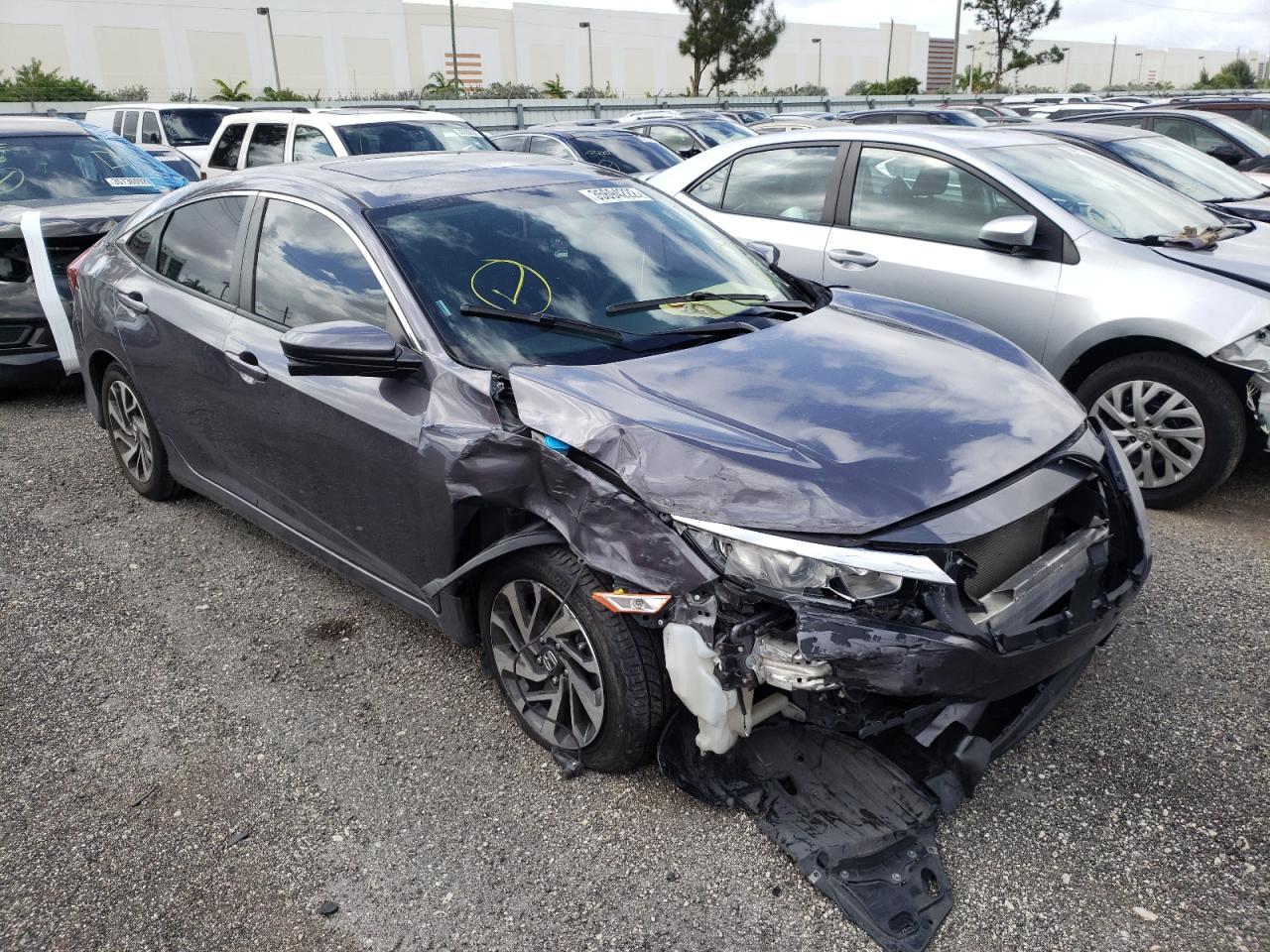 HONDA CIVIC EX 2017 with VIN 19XFC2F7XHE052465 - Photo from auction
