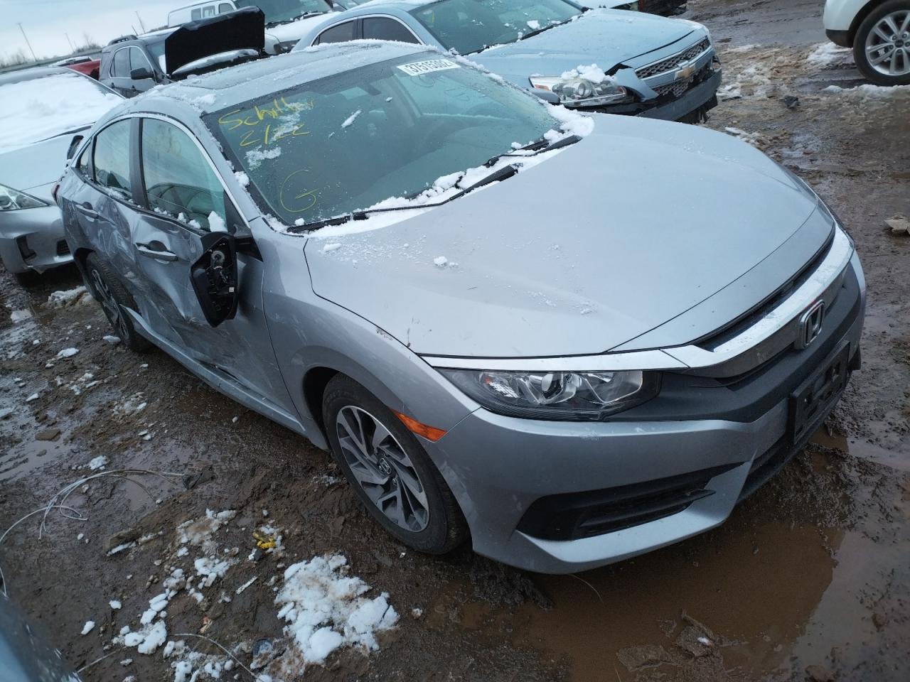 HONDA CIVIC EX 2018 with VIN 19XFC2F70JE026527 - Photo from auction