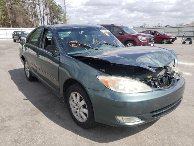 TOYOTA CAMRY LE 2004 with VIN JTDBF32K540154569 - Photo from auction
