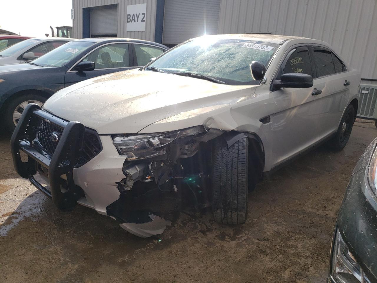 Photo 2 from auction – 2014 FORD TAURUS POL with VIN 1FAHP2MT9EG183630