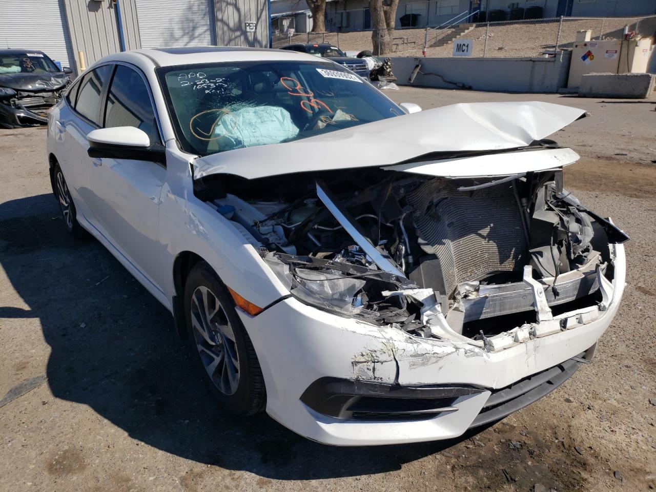 HONDA CIVIC EX 2018 with VIN 19XFC2F7XJE023084 - Photo from auction