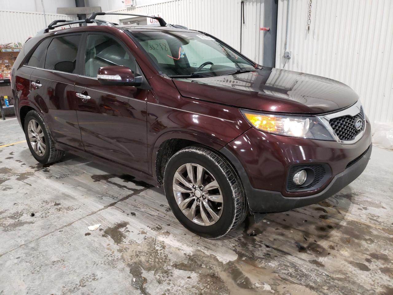 KIA SORENTO SX 2013 with VIN 5XYKW4A20DG360528 - Photo from auction