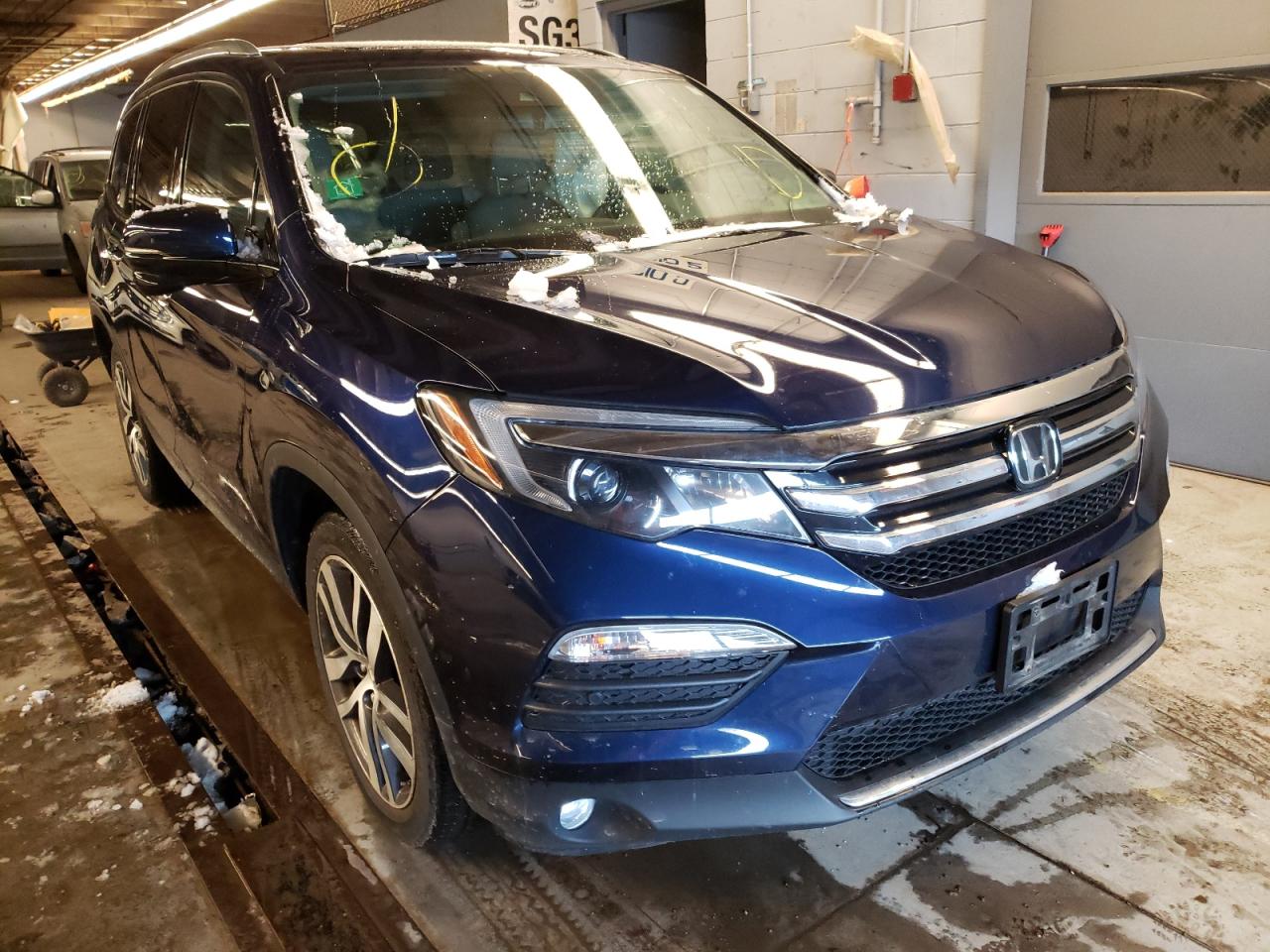 HONDA PILOT TOUR 2017 with VIN 5FNYF6H96HB081347 - Photo from auction