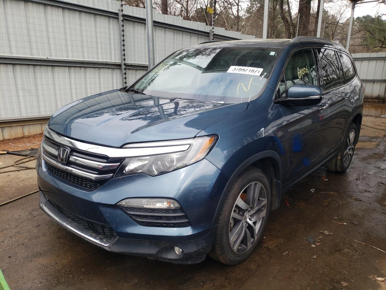 Photo 2 from auction – 2018 HONDA PILOT ELIT with VIN 5FNYF6H0XJB015133