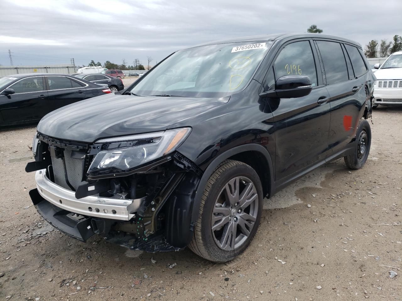 Photo 2 from auction – 2021 HONDA PASSPORT E with VIN 5FNYF7H53MB010586