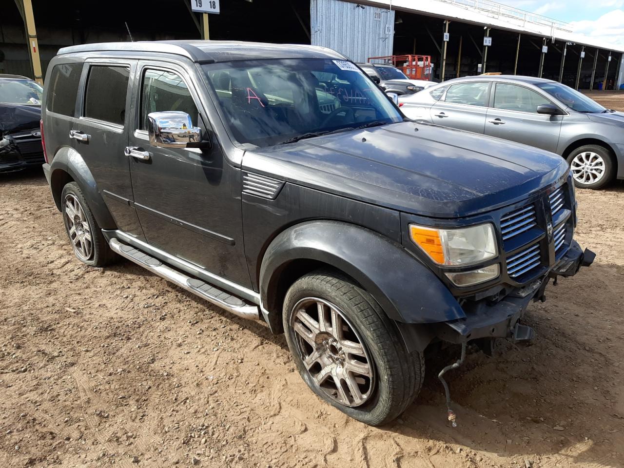 DODGE NITRO HEAT 2011 with VIN 1D4PT4GKXBW589825 - Photo from auction