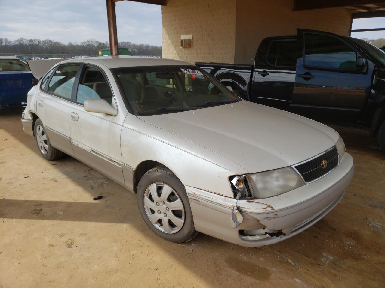 TOYOTA AVALON 1999 with VIN 4T1BF18B2XU328392 - Photo from auction