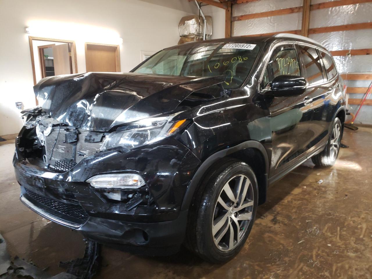 Photo 2 from auction – 2016 HONDA PILOT TOUR with VIN 5FNYF6H91GB106086