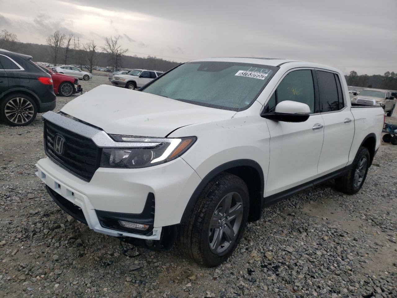 Photo 2 from auction – 2022 HONDA RIDGELINE with VIN 5FPYK3F71NB007204
