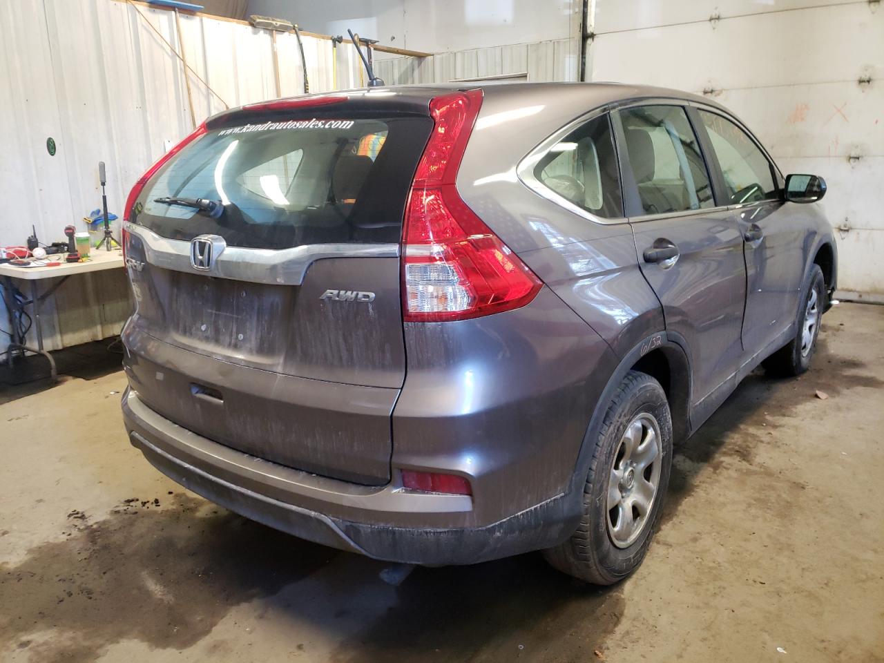 Photo 4 from auction – 2015 HONDA CR-V LX with VIN 5J6RM4H33FL023307