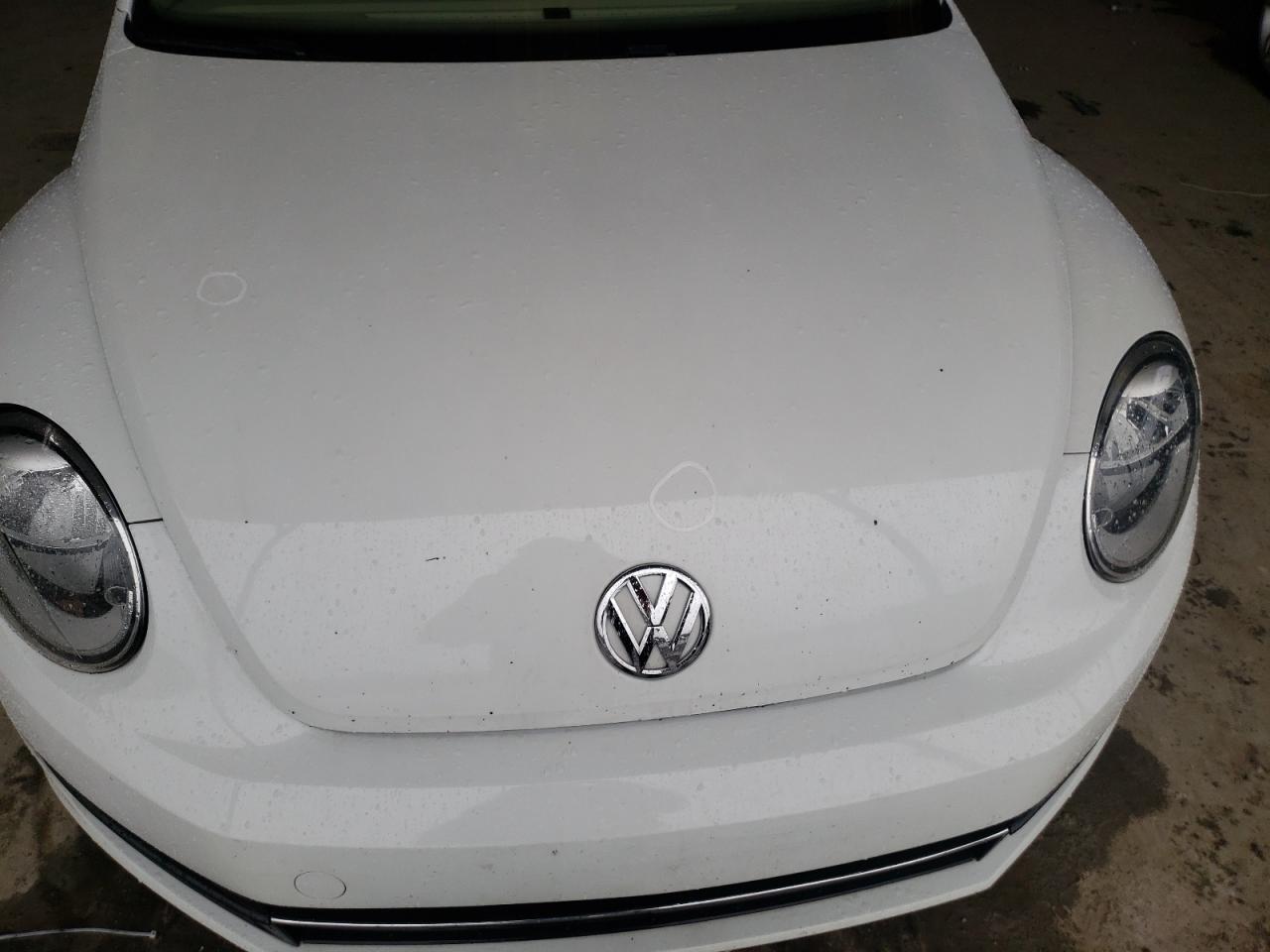 Photo 9 from auction – 2014 VOLKSWAGEN BEETLE with VIN 3VWJ17AT5EM633694