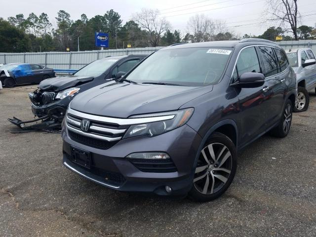 Photo 2 from auction – 2017 HONDA PILOT TOUR with VIN 5FNYF5H99HB011142