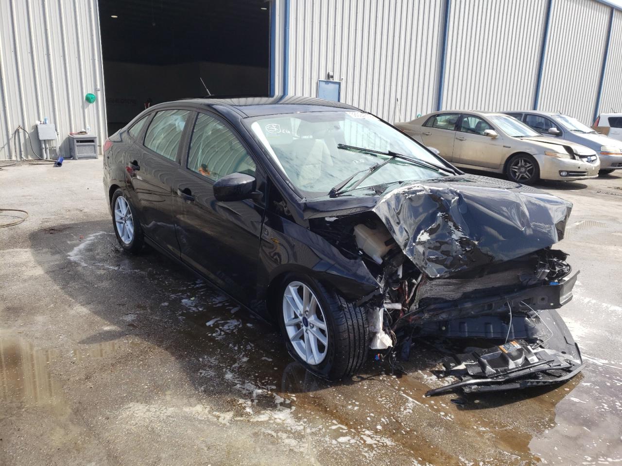 FORD FOCUS SE 2018 with VIN 1FADP3F29JL289053 - Photo from auction