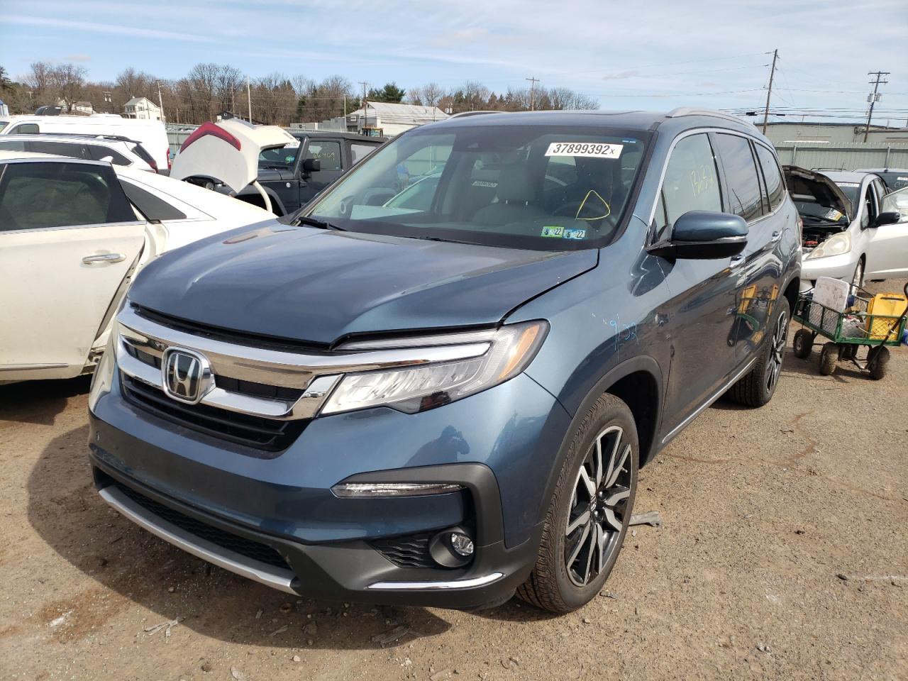 Photo 2 from auction – 2021 HONDA PILOT TOUR with VIN 5FNYF6H66MB063656