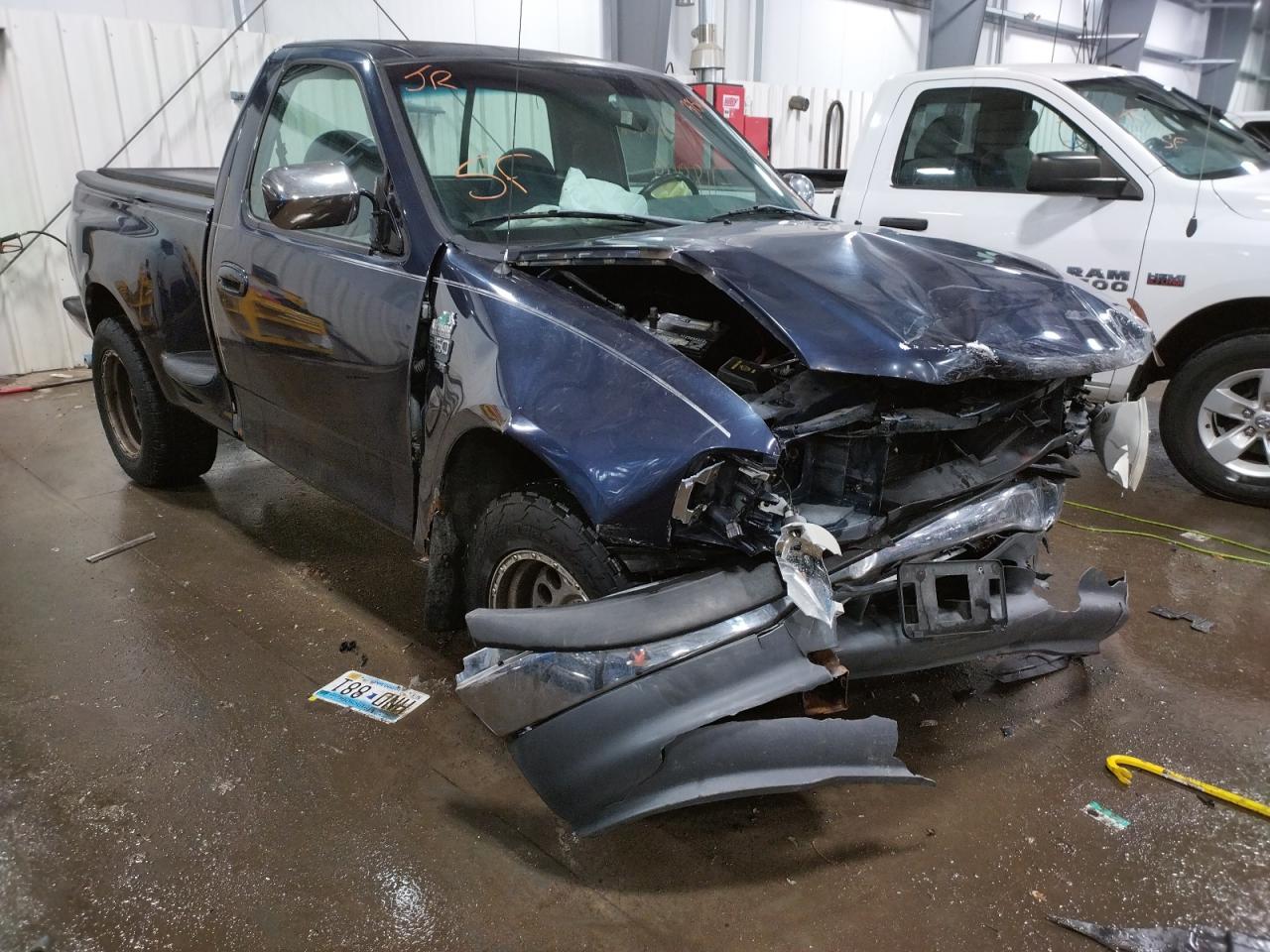 FORD F150 1999 with VIN 2FTRF07L4XCA03055 - Photo from auction