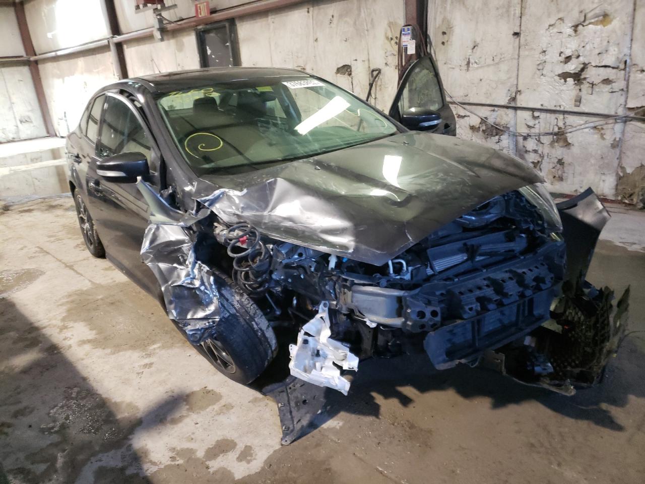 FORD FOCUS SEL 2017 with VIN 1FADP3H25HL323450 - Photo from auction