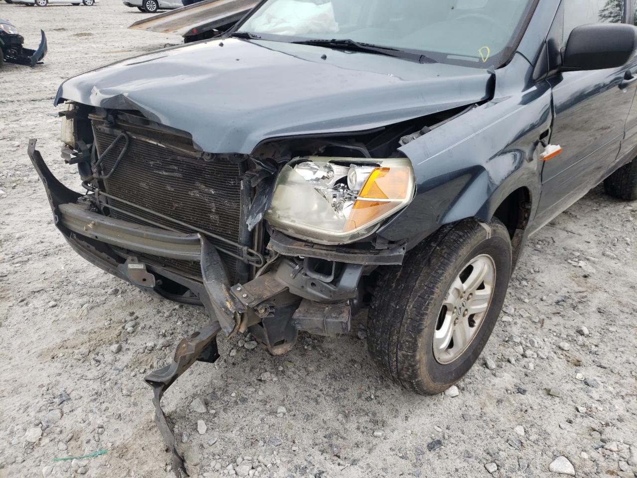 Photo 9 from auction – 2006 HONDA PILOT LX with VIN 5FNYF281X6B006490