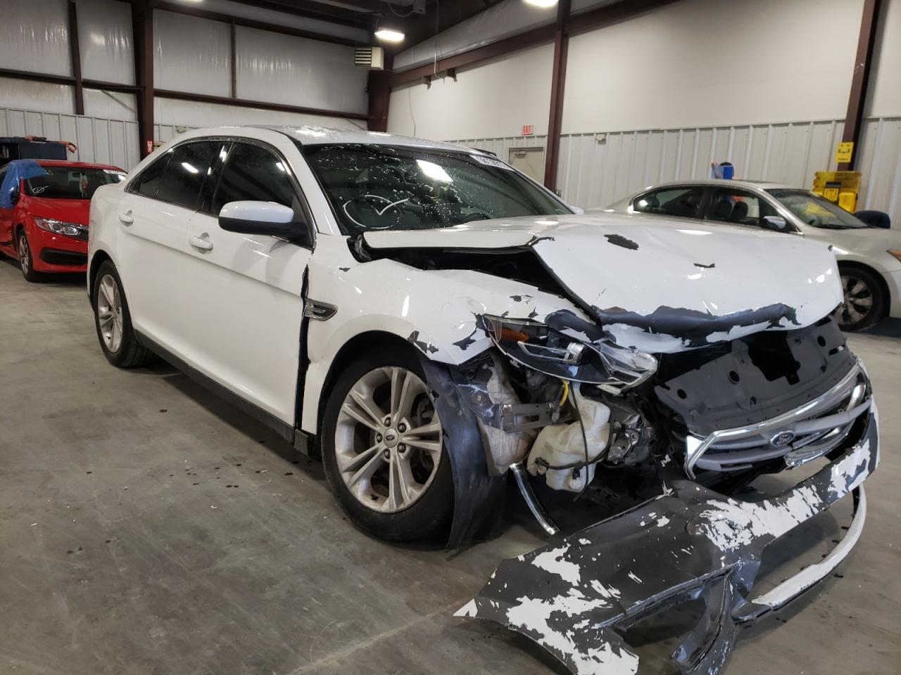 FORD TAURUS SEL 2015 with VIN 1FAHP2E9XFG195306 - Photo from auction