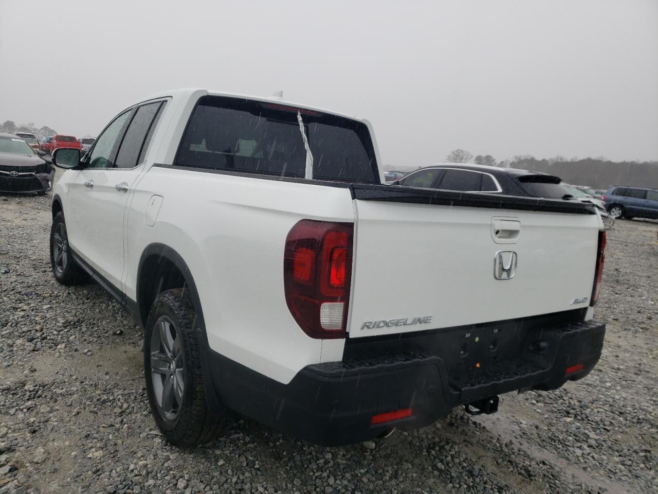 Photo 3 from auction – 2022 HONDA RIDGELINE with VIN 5FPYK3F71NB007204