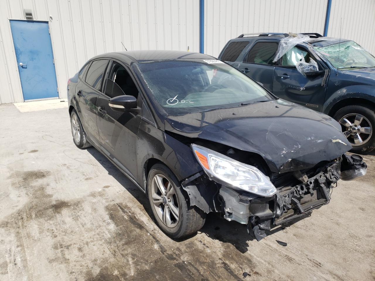 FORD FOCUS SE 2014 with VIN 1FADP3F29EL159909 - Photo from auction