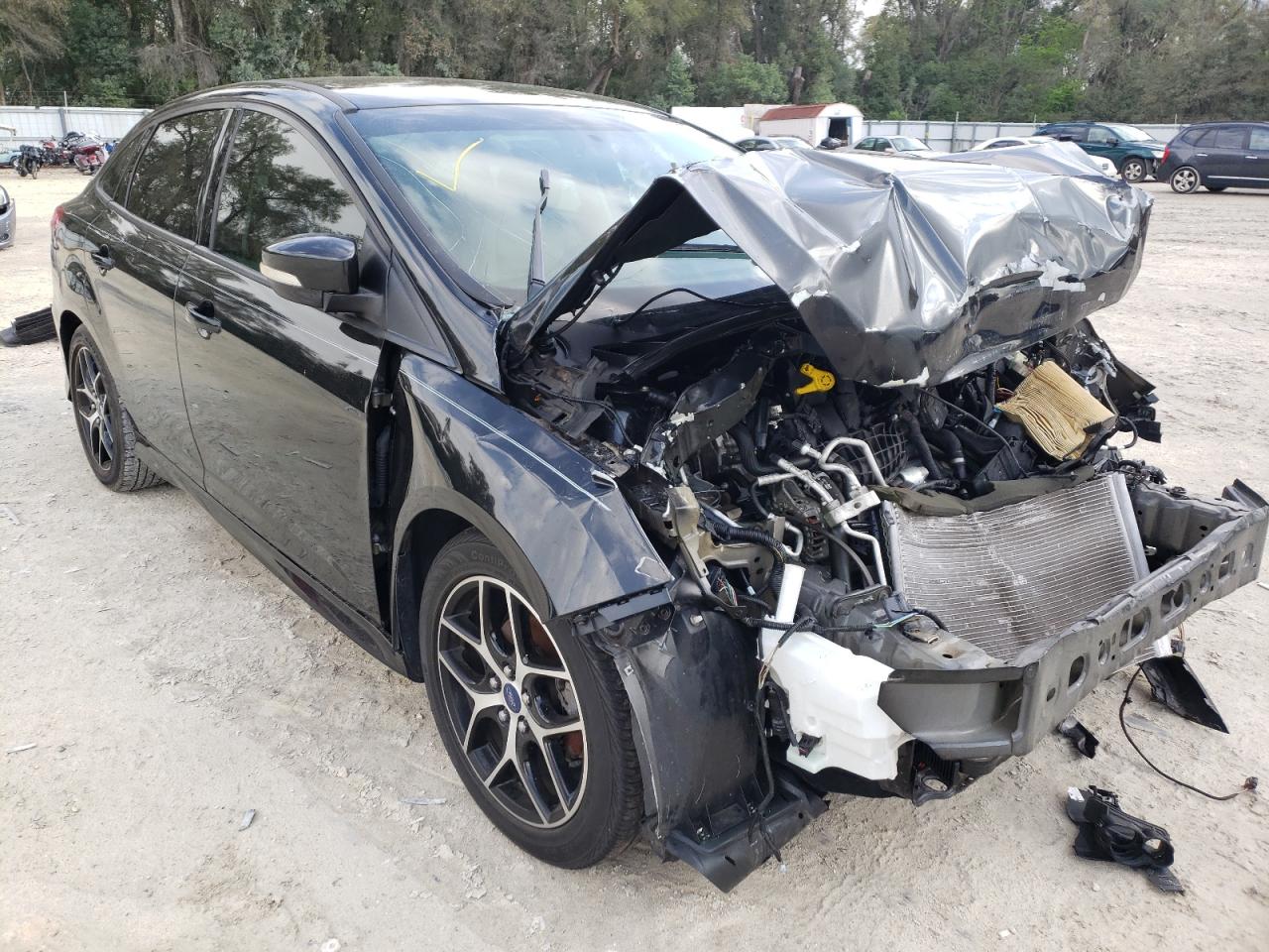 FORD FOCUS SE 2015 with VIN 1FADP3F25FL339101 - Photo from auction