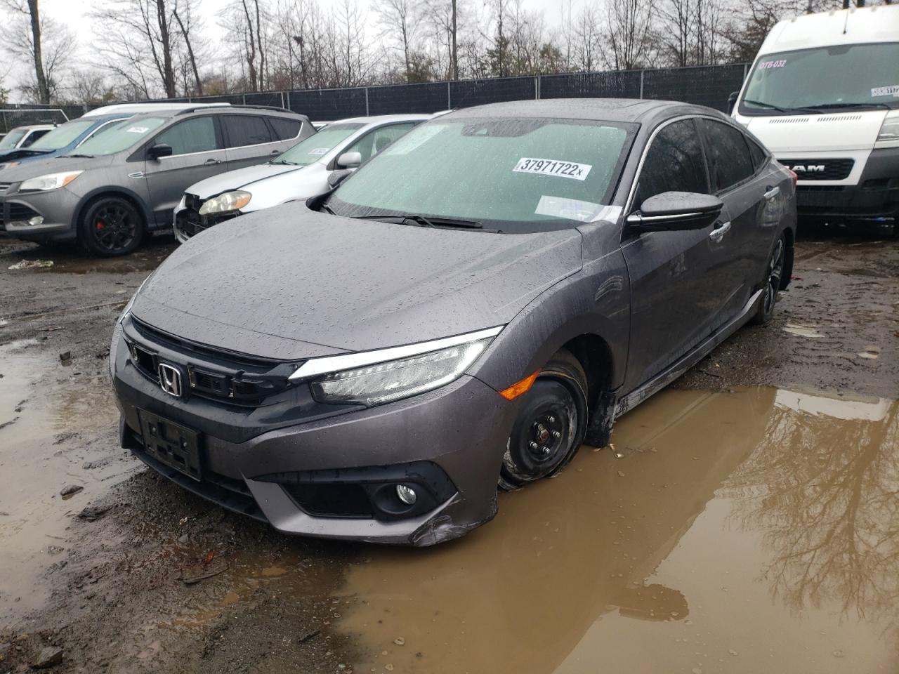 Photo 2 from auction – 2016 HONDA CIVIC TOUR with VIN 19XFC1F98GE223899