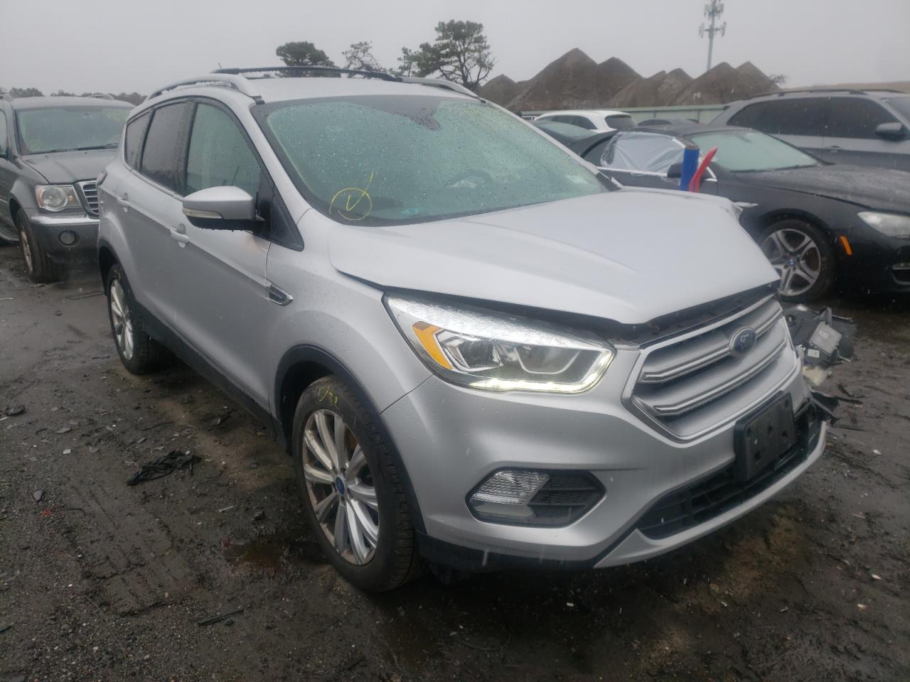 FORD ESCAPE TIT 2017 with VIN 1FMCU9J94HUD32901 - Photo from auction