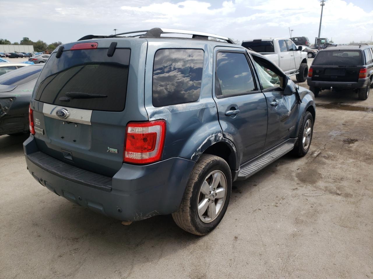 Photo 4 from auction – 2011 FORD ESCAPE LIM with VIN 1FMCU0EGXBKB89024