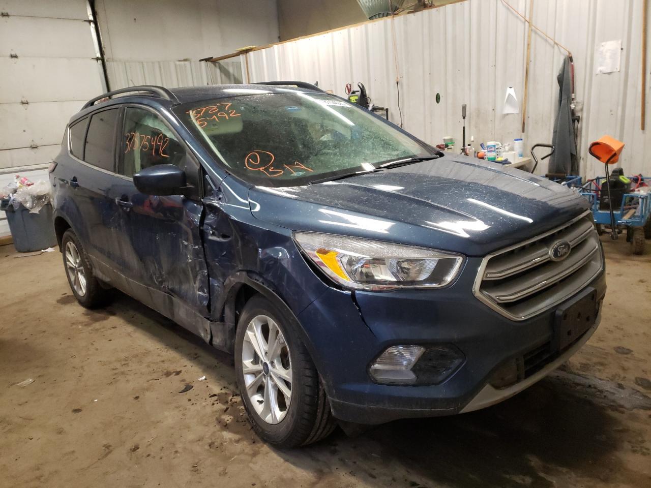 FORD ESCAPE SE 2018 with VIN 1FMCU9GD6JUB57956 - Photo from auction