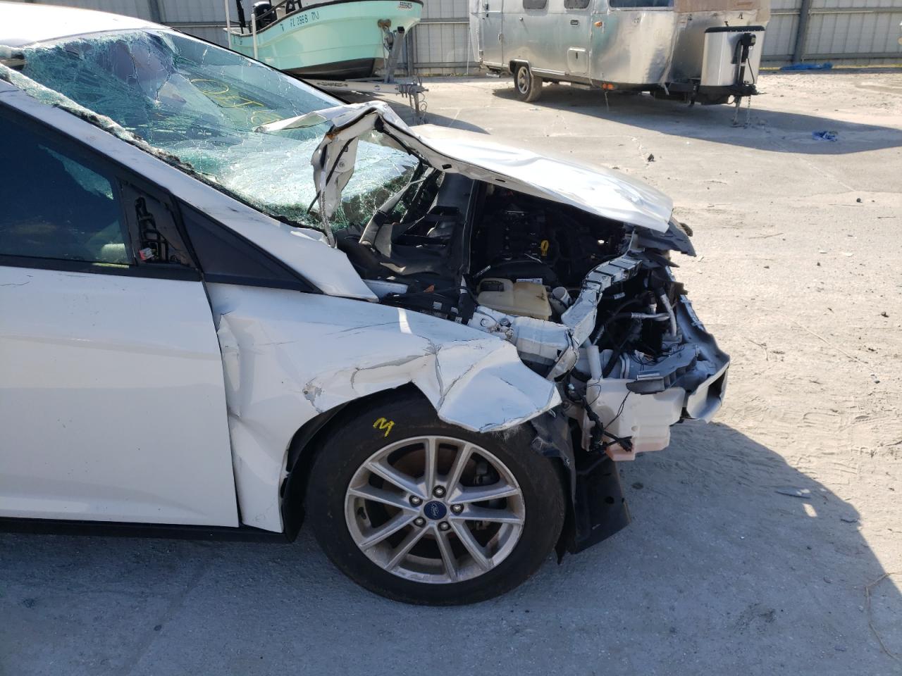 Photo 9 from auction – 2017 FORD FOCUS SE with VIN 1FADP3F25HL302083