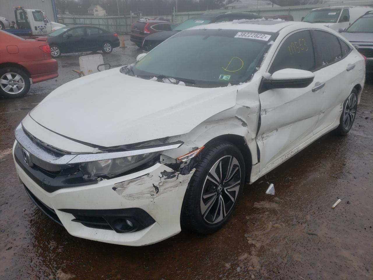Photo 2 from auction – 2016 HONDA CIVIC EX with VIN 2HGFC1F33GH631843