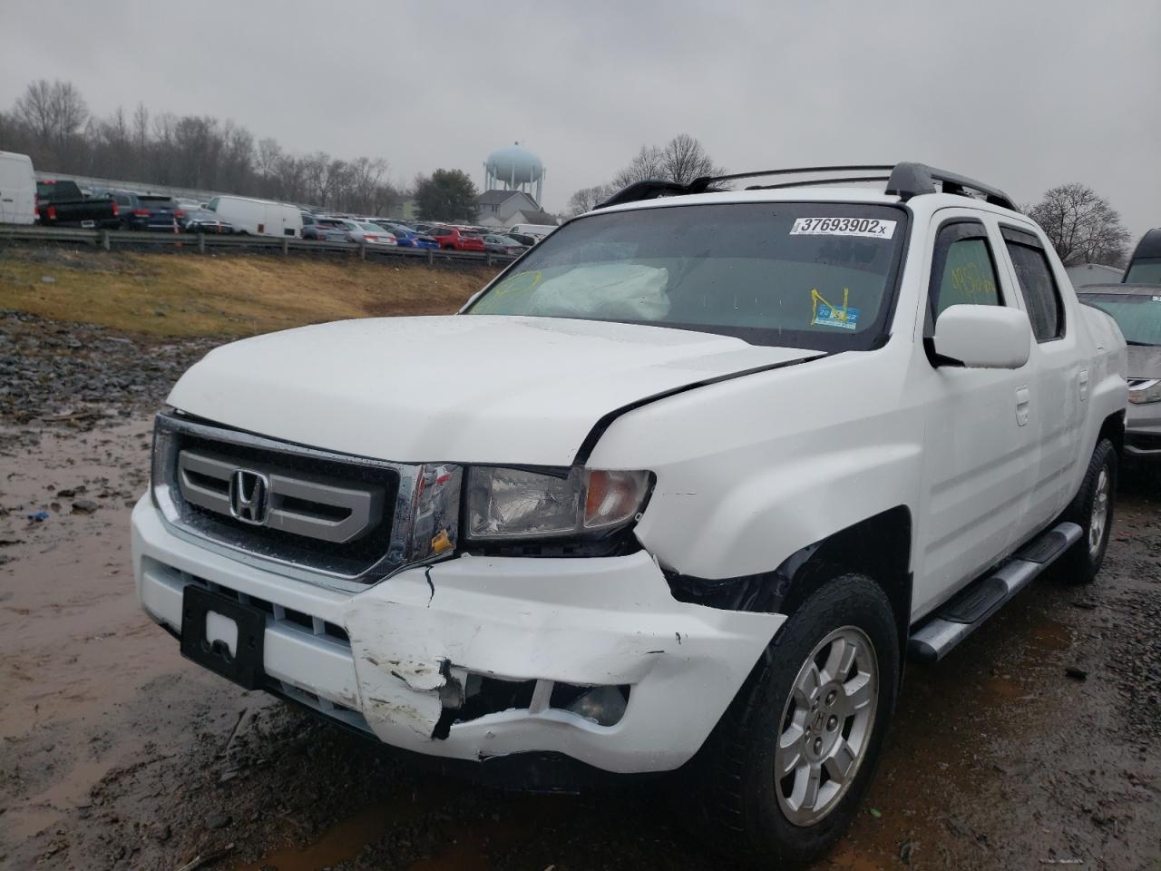 Photo 2 from auction – 2011 HONDA RIDGELINE with VIN 5FPYK1F45BB001850