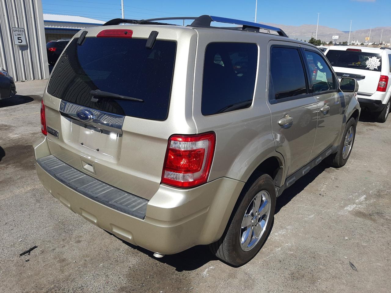 Photo 4 from auction – 2010 FORD ESCAPE LIM with VIN 1FMCU0E72AKD46415