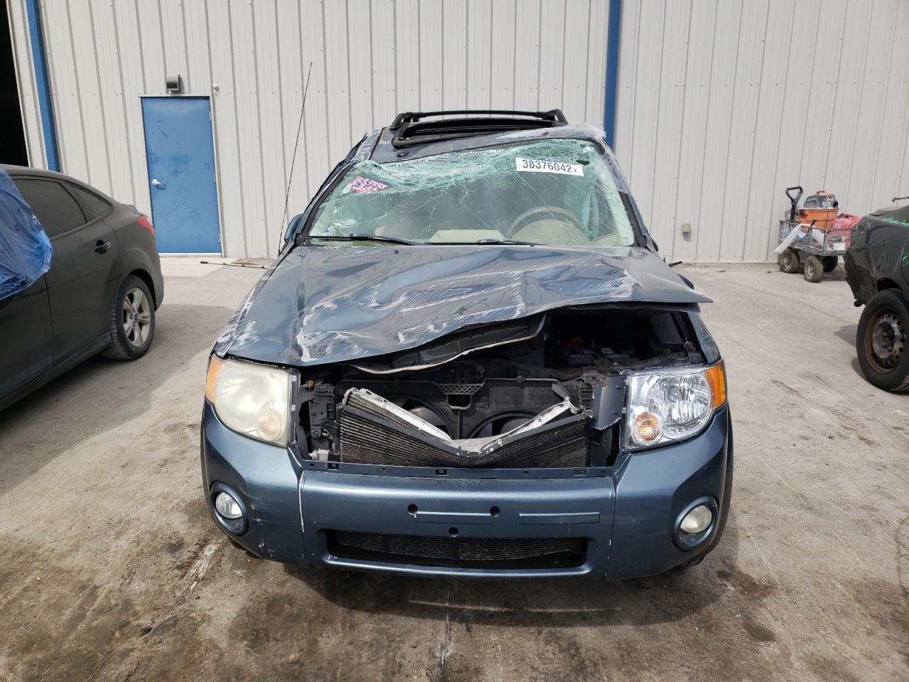 Photo 9 from auction – 2011 FORD ESCAPE LIM with VIN 1FMCU0EGXBKB89024